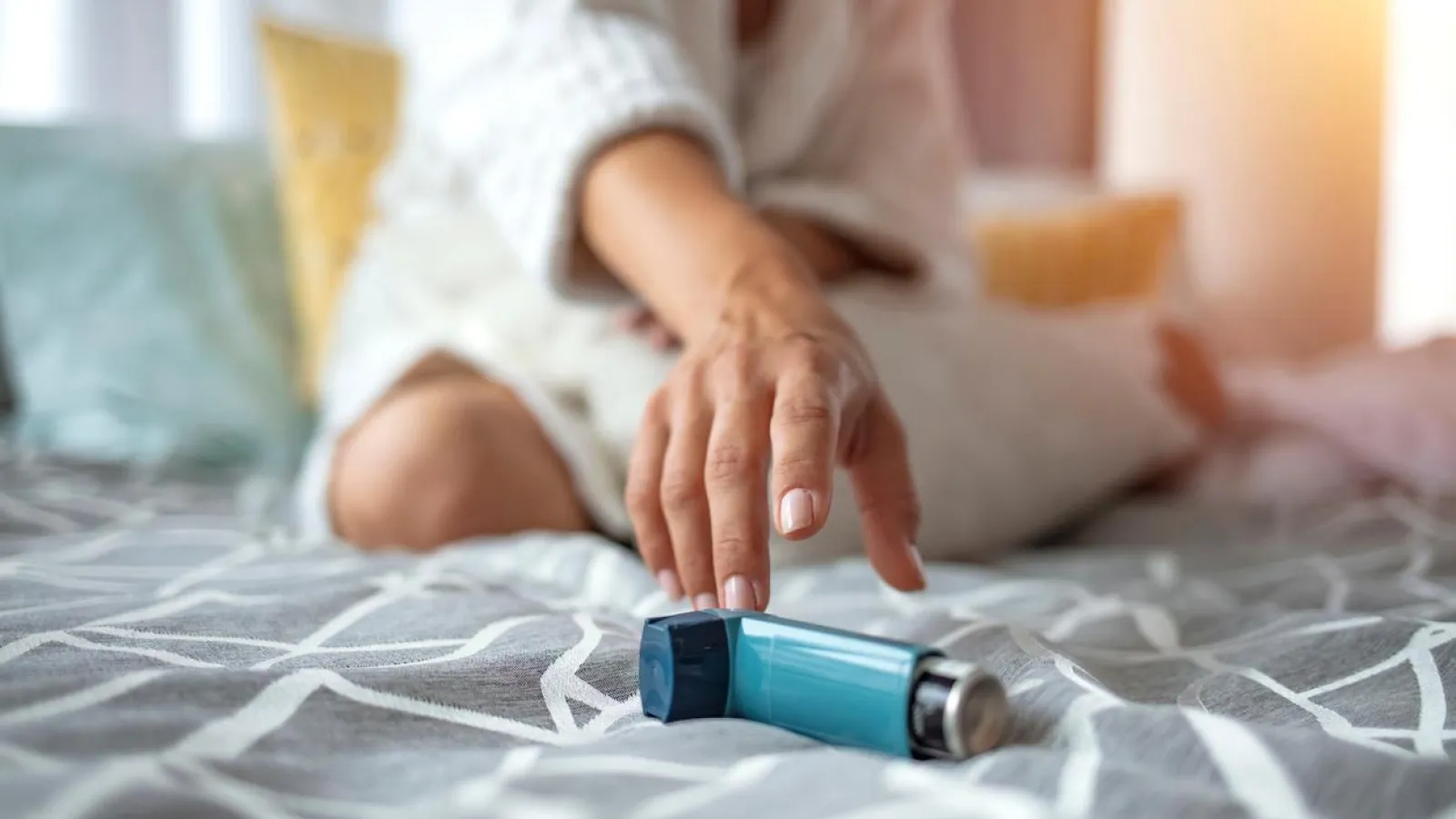 Asmathic girl catching inhaler